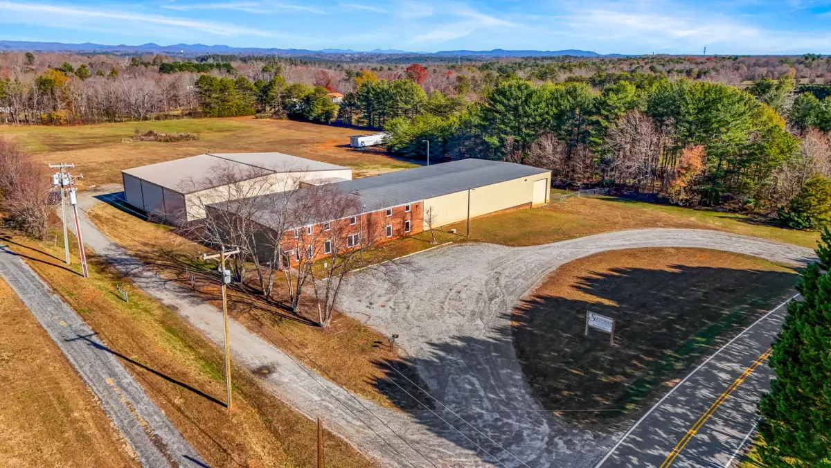 Inside Southern Storage indoor boat storage facility showing pontoon boats lined up in clean climate-controlled warehouse Connelly Springs NC
